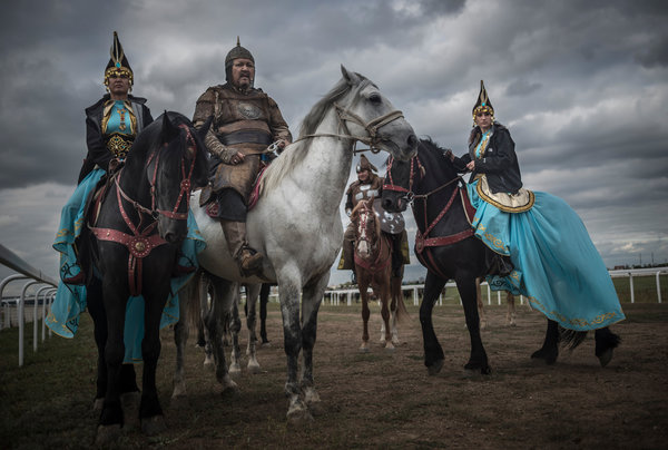 Kazakhs in traditional dress at the first Central Asian championship of kokpar, similar to polo, in Astana.